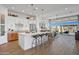Modern kitchen with white cabinets, a large island, and stainless steel appliances at 26032 S 229Th Pl, Queen Creek, AZ 85142