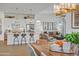 Open concept kitchen with a large island and views into the dining area at 26032 S 229Th Pl, Queen Creek, AZ 85142