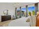 Bright bedroom with large windows and comfortable bed at 26032 S 229Th Pl, Queen Creek, AZ 85142