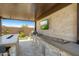 Luxury outdoor kitchen featuring stainless steel appliances and stonework at 26032 S 229Th Pl, Queen Creek, AZ 85142