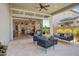 Covered patio with seating area and view into the home at 26032 S 229Th Pl, Queen Creek, AZ 85142