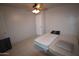 Simple bedroom with twin bed and ceiling fan at 3418 W Roma Ave, Phoenix, AZ 85017