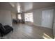 Bright living room with light flooring and a comfy couch at 3418 W Roma Ave, Phoenix, AZ 85017