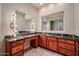 Vanity with granite countertop and wood cabinets at 3702 E Brown Rd, Mesa, AZ 85205