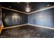 Dark-blue bedroom with hardwood floors and a chandelier at 3702 E Brown Rd, Mesa, AZ 85205