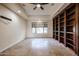 Bright bedroom with built-in shelving and large window at 3702 E Brown Rd, Mesa, AZ 85205