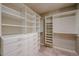 White walk-in closet with ample shelving at 3702 E Brown Rd, Mesa, AZ 85205