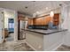 Modern kitchen with granite countertops and stainless steel appliances at 3702 E Brown Rd, Mesa, AZ 85205