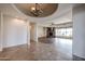 Open living area with tile floors, fireplace, and large windows at 3702 E Brown Rd, Mesa, AZ 85205