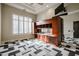 Home office with wood built-ins and geometric carpet at 3702 E Brown Rd, Mesa, AZ 85205