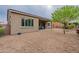 Desert landscaping surrounds this home's backyard with covered patio at 379 N Marcos Ct, Casa Grande, AZ 85194