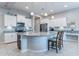 Modern kitchen with granite island and white cabinets at 379 N Marcos Ct, Casa Grande, AZ 85194