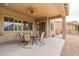 Covered patio with seating for four and ceiling fan at 379 N Marcos Ct, Casa Grande, AZ 85194