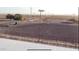 Tractor working in a fenced arena with stadium lighting and spectator area at 4309 E Laughlin Rd, Casa Grande, AZ 85194