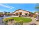 Backyard oasis with a pool, spa, and covered patio at 4633 N 127Th Dr, Litchfield Park, AZ 85340