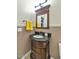 Small bathroom with a pedestal sink and dark brown vanity at 4633 N 127Th Dr, Litchfield Park, AZ 85340