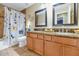 Bathroom with double sinks, granite countertop, and shower at 4633 N 127Th Dr, Litchfield Park, AZ 85340