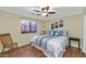 Bedroom with wood flooring and blue and white bedding at 4633 N 127Th Dr, Litchfield Park, AZ 85340