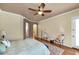 Spacious bedroom with ceiling fan and hardwood floors at 4633 N 127Th Dr, Litchfield Park, AZ 85340