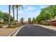 Gated community entrance with lush landscaping and a welcoming atmosphere at 4633 N 127Th Dr, Litchfield Park, AZ 85340