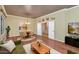 Dining area with wood floors, chandelier lighting, and view into the kitchen at 4633 N 127Th Dr, Litchfield Park, AZ 85340