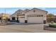 Stunning home exterior with a two-car garage and attractive landscaping at 4633 N 127Th Dr, Litchfield Park, AZ 85340
