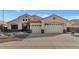 Beautiful two-story home with a three-car garage and well-manicured landscaping at 4633 N 127Th Dr, Litchfield Park, AZ 85340
