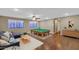 Basement game room featuring a pool table, sectional sofa, and wood floors at 4633 N 127Th Dr, Litchfield Park, AZ 85340