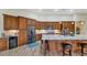Spacious kitchen featuring granite countertops and modern wood cabinets at 4633 N 127Th Dr, Litchfield Park, AZ 85340