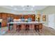 Gourmet kitchen featuring a large island, granite countertops, and stainless steel appliances at 4633 N 127Th Dr, Litchfield Park, AZ 85340