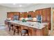 Spacious kitchen with a large island, stainless steel appliances, and beautiful cabinetry at 4633 N 127Th Dr, Litchfield Park, AZ 85340