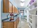 Spacious laundry room with ample cabinet and shelf storage at 4633 N 127Th Dr, Litchfield Park, AZ 85340