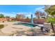 Relaxing kidney-shaped pool with a stone patio at 4633 N 127Th Dr, Litchfield Park, AZ 85340