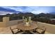 Enjoy breathtaking sunset views from this patio with a wooden dining set at 4748 E White Dr, Paradise Valley, AZ 85253