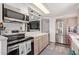 Kitchen featuring stainless steel appliances, white countertops, and plenty of cabinet space at 5424 E Arbor Ave, Mesa, AZ 85206