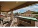 Back patio with outdoor furniture and a built-in grill at 684 S 231St Dr, Buckeye, AZ 85326