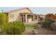 Landscaped backyard with a patio and built-in grill at 684 S 231St Dr, Buckeye, AZ 85326