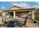 Covered patio with outdoor furniture, a built-in grill, and a paved patio at 684 S 231St Dr, Buckeye, AZ 85326