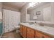 Bathroom boasts granite countertop, light wood cabinets, and shower/tub combo at 684 S 231St Dr, Buckeye, AZ 85326