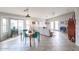 Charming dining area with teal chairs and wood table at 684 S 231St Dr, Buckeye, AZ 85326