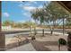 Desert landscaping with cacti and a paved driveway in front of a house at 684 S 231St Dr, Buckeye, AZ 85326