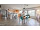 Bright kitchen with an island, stainless steel appliances, and tile flooring at 684 S 231St Dr, Buckeye, AZ 85326