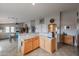 Eat-in kitchen with granite island and open floor plan at 684 S 231St Dr, Buckeye, AZ 85326