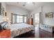 Large main bedroom with hardwood floors and en-suite bathroom at 684 S 231St Dr, Buckeye, AZ 85326