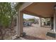 Covered patio with pavers, seating area, and built-in grill at 684 S 231St Dr, Buckeye, AZ 85326