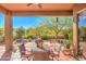 Covered patio with seating area and desert views at 7143 E Canyon Wren Dr, Gold Canyon, AZ 85118