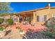 Spacious patio with seating area, surrounded by desert plants at 7143 E Canyon Wren Dr, Gold Canyon, AZ 85118