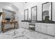 Luxurious bathroom with dual vanities, marble floors, and large mirrors at 7514 N 22Nd Pl, Phoenix, AZ 85020