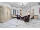 Spacious bedroom with a large four poster bed and marble floors at 7514 N 22Nd Pl, Phoenix, AZ 85020