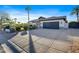 Home's exterior showcases a spacious driveway and well-maintained landscaping at 7514 N 22Nd Pl, Phoenix, AZ 85020